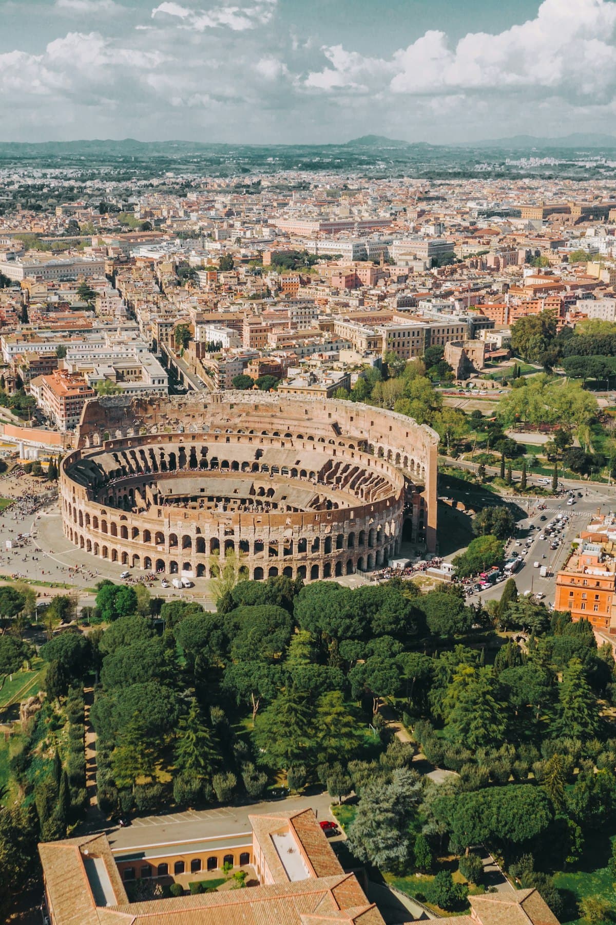 The Colosseum and the rooftops of Rome seen from the air